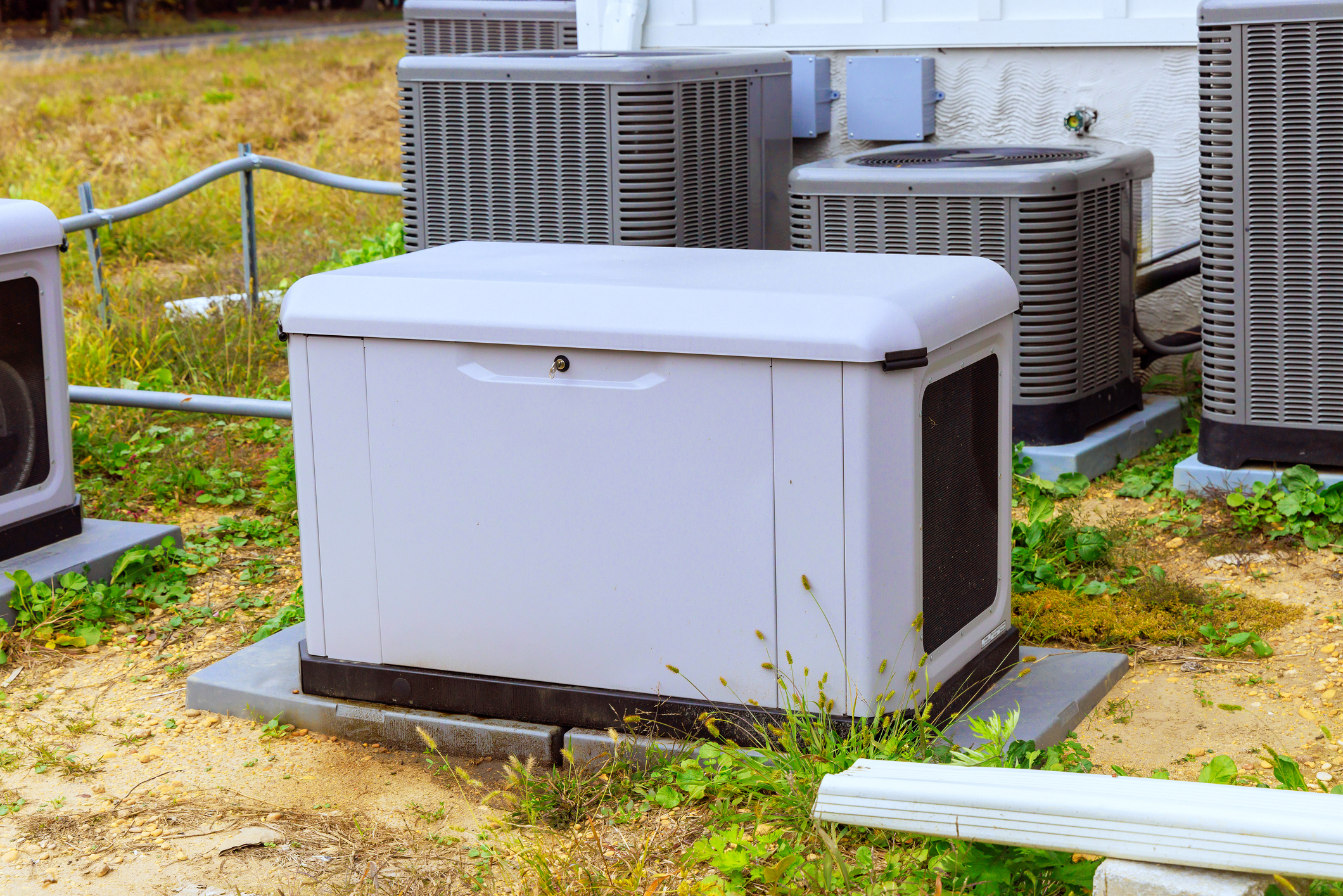 Whole-home generator in front of HVAC units